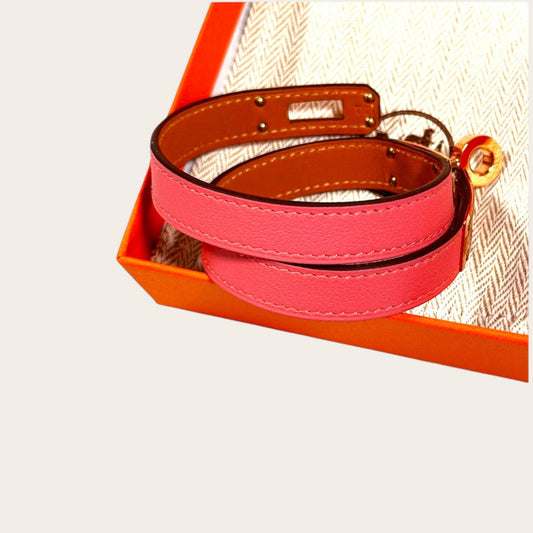 Hermès Kelly Double Tour bracelet in Rose Sakura Swift leather with rose gold-plated hardware and Touret clasp.