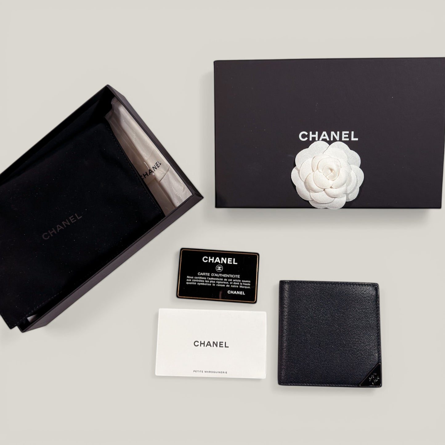 EDIT8 COLLECTIVE Chanel black caviar leather bifold wallet with card slots and bill compartments. Includes box, authenticity card, dust bag.