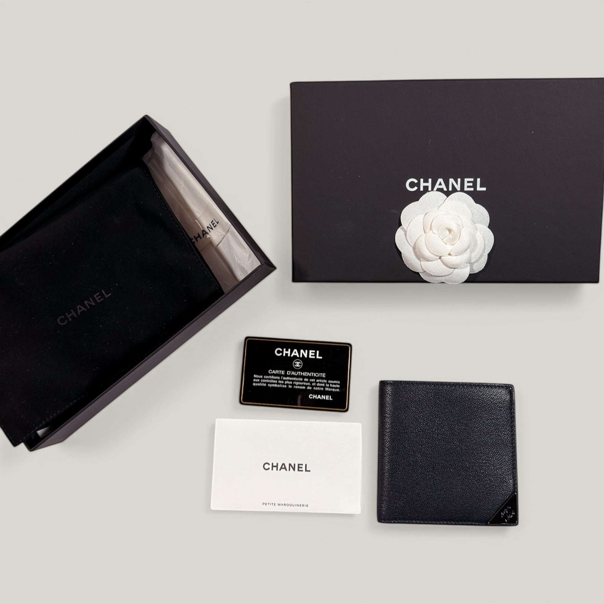 EDIT8 COLLECTIVE Chanel black caviar leather bifold wallet with card slots and bill compartments. Includes box, authenticity card, dust bag.