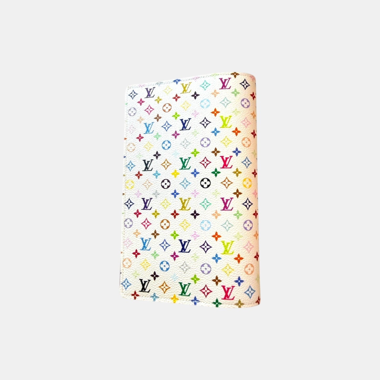 EDIT8 COLLECTIVE Louis Vuitton x Murakami white notebook cover with multicolor monogram pattern.