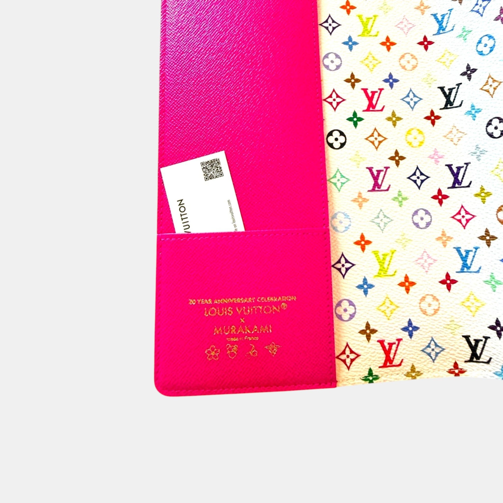 EDIT8 COLLECTIVE Louis Vuitton x Murakami Emily notebook cover in pink with multicolor monogram print. Features a card slot.